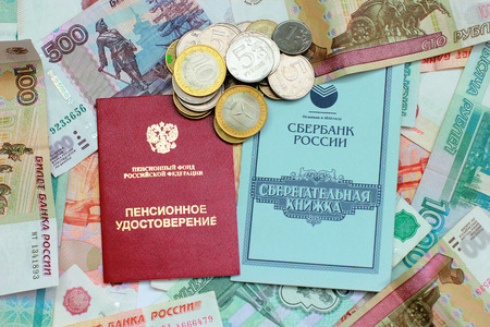 Pension certificate, passbook and money closeupの写真素材