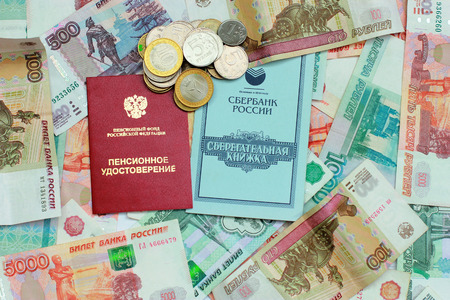 Passbook, pension certificate and Russian moneyの写真素材