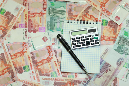 Money, pen, notepad and calculatorの写真素材