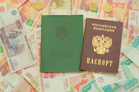 Russian passport and employment history are on the Russian moneyの写真素材