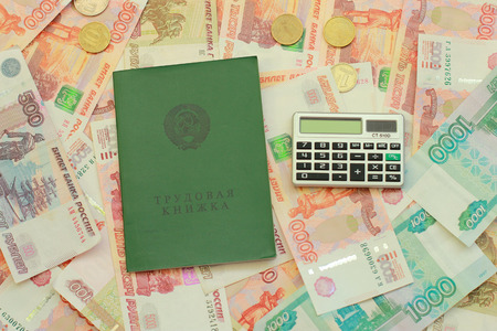 Work-book and calculator on Russian moneyの写真素材