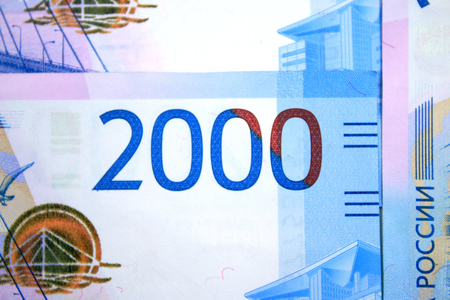 New bills 2 thousand rubles close-up. Fragment with the number 2000の写真素材