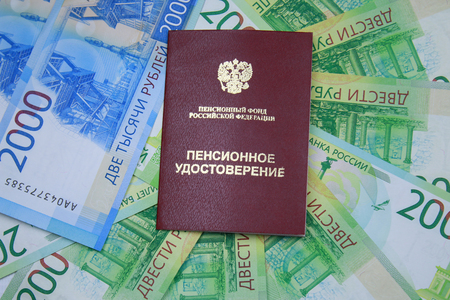 Pension certificate and new Russian banknotes in denominations of 2000 and 200 rublesの写真素材