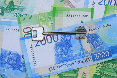 Buying a property. The keys to the apartment are on Russian money. Close-upの写真素材