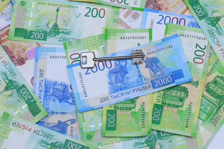 Buying a property. The keys to the apartment are on Russian money. Close-up.の写真素材