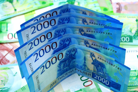 Russian money of different denominations. New two thousand rubles close-up.の写真素材