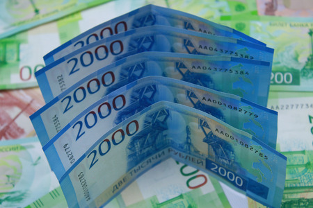 Russian money of different denominations. New two thousand rubles close-up.の写真素材