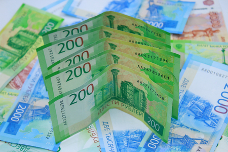 New Russian bills 200 rubles on the background of moneyの写真素材
