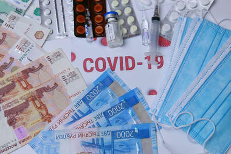 Antibiotics against coronavirus, pills, a syringe, medical masks and Russian money.の写真素材