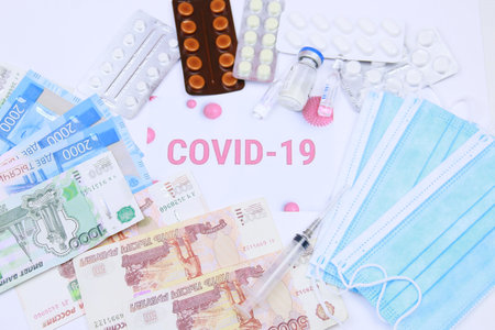 medicines against coronavirus. Various pills, syringes, protective medical mask and Russian money.の写真素材