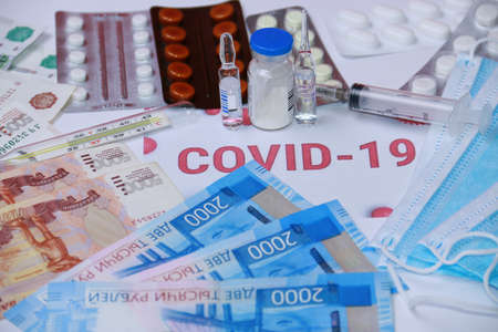 Antibiotics against coronavirus, pills, a syringe, medical masks and Russian money.の写真素材