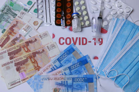 medicines against coronavirus. Various pills, syringes, masks, antibiotics and Russian money.の写真素材