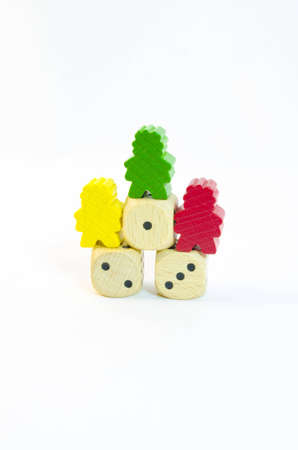 Three multi-colored figures on cubes with numbers