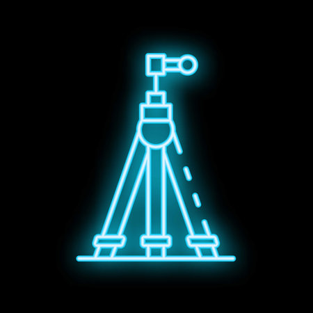 Blue neon icon of a tripod on a black background, symbolizing photography, video recording, and content creationのイラスト素材