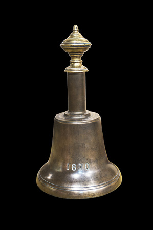 A vintage copper bell on black backgroundの写真素材