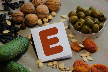 Foods containing vitamin E : cucumber, olives, dried apricots, nuts, sunflower seeds and pumpkin seedsの写真素材
