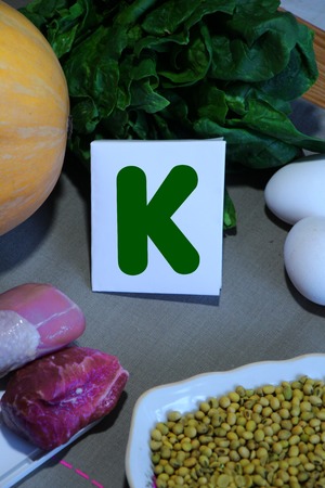 Foods containing vitamin K : eggs, soy, meat, squash, spinachの写真素材