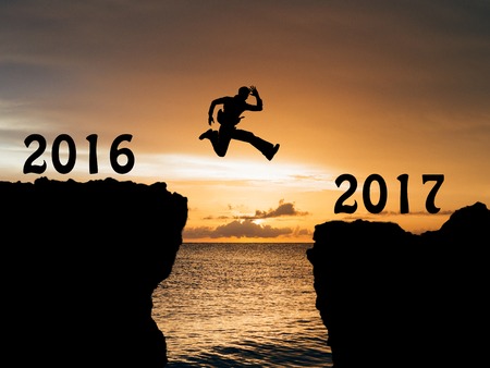 A man jump between 2016 and 2017 years.の写真素材