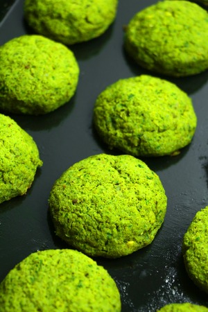 Healthy baked chickpea falafel on a baking tray. National Arabic food. Cooking at home. Healthy cooking concept.の写真素材