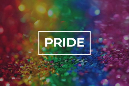 Pride Sign Over a Colorful Rainbow Background. Human Rights Concept.