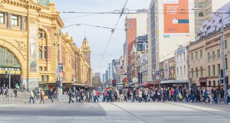 Melbourne, Australia - July 21, 2014: Busy crosswalk outside Flinders Street Station in Melbourne, Australiaのeditorial素材