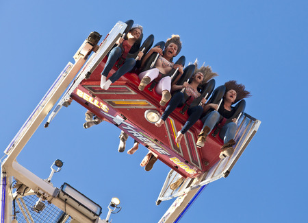 Adelaide, Australia - September 9, 2012: Four girls screaming on the amusement park ride in the 237th Royal Adelaide Show in Adelaide, South Australiaのeditorial素材