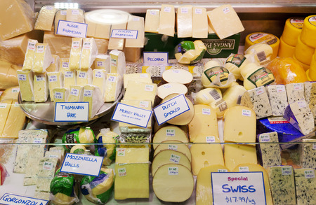 Adelaide, Australia - September 14, 2012: Variety of cheese selling in a cheese shop in Adelaide Central Market, which is a popular tourist attraction and large multicultural market in the central business district in Adelaide, Australia.のeditorial素材