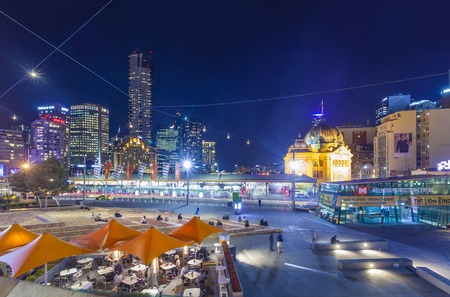 Melbourne, Australia - April 30, 2015: View of modern buildings and Flinders Street Railway Station in Melbourne, Australia at nightのeditorial素材