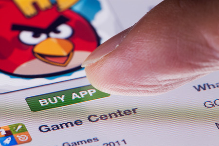 Hong Kong, China - July 31, 2011: Macro image of an ipad, showing the action of clicking the 'BUY APP' button in App Storeのeditorial素材