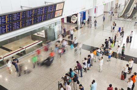 Hong Kong, China - June 12, 2015: People in the arrival hall of Hong Kong International Airport, waiting for their arriving friends and relativesのeditorial素材