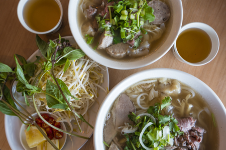 Vietnamese beef noodle soup for two with tea and bean sprout