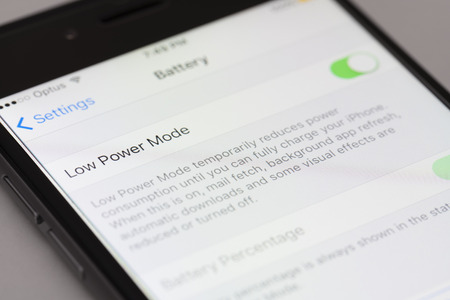 Melbourne, Australia - Sep 24, 2015: Enabling low power mode on an iPhone running iOS 9.  This is a...