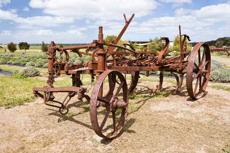 View of an antique rusty plough in a farmの写真素材