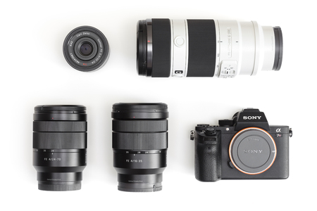 Melbourne, Australia - Feb 10, 2016: Flat lay photo of Sony A7R II  mirrorless camera and E-mount lenses. The camera features the world's first 35mm backside illumination CMOS sensor.のeditorial素材