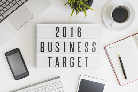 2016 business target on office table with computer, coffee, notepad, smartphone and digital tablet