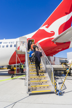 Melbourne, Australia - September 20, 2016: View of passengers boarding the Qantas aircraft at Melbourne Airport during daytime. Qantas is the largest domestic and international airline in Australia.のeditorial素材