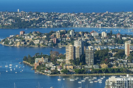 Houses and apartments in the suburbs along the shore of Sydney Harbourの写真素材