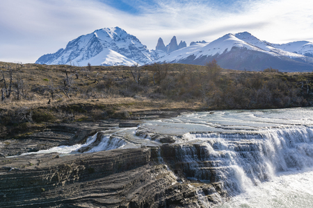 Waterfall and granite towers at Torres del Paine national park of Chileの写真素材