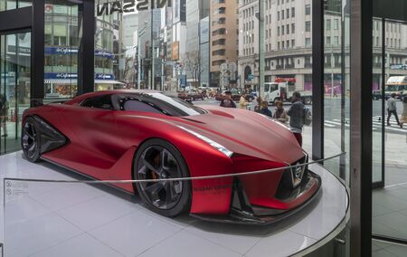 Tokyo, Japan - Mar 26, 2019: People looking at a Nissan Concept 2020 Vision Gran Turismo car in a...