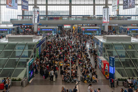 Passengers in a busy railway station in China