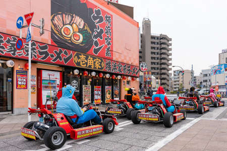 Tourists driving go-kart on the street of Tokyoのeditorial素材