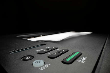 Close-up view of printing documents using laser printerの写真素材