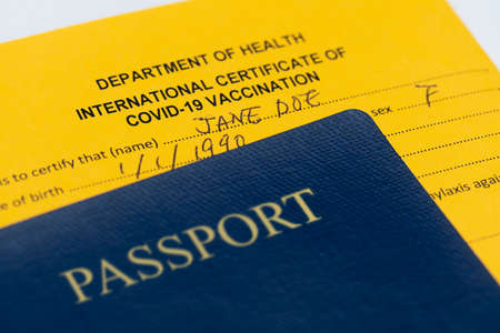 Macro shot of doctor issuing Covid-19 international vaccination certificate, shot with macro probe lensの写真素材