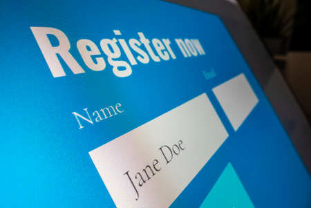 Completing registration form onlineの写真素材