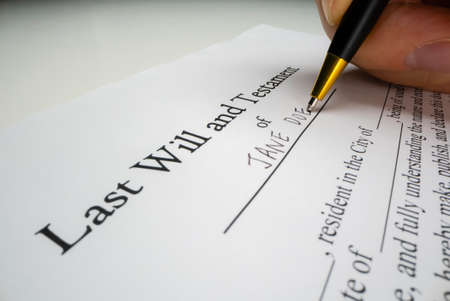 Close-up view of writing a last willの写真素材