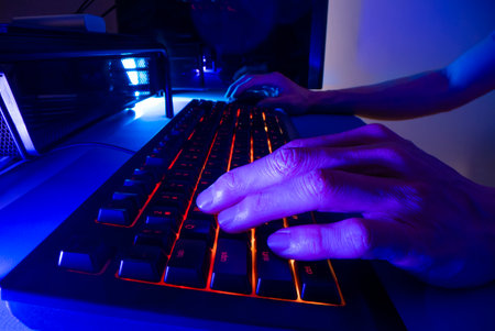 Playing computer game with gaming keyboard, shot with macro probe lensの写真素材