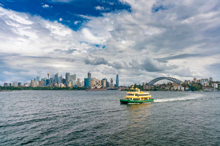 Sydney, Australia - Mar 25, 2022: View of Sydney skyline with ferry passing byのeditorial素材