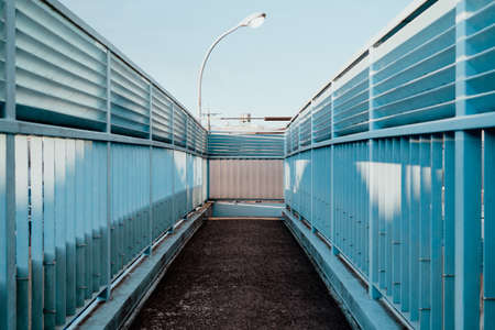 Light illuminating a pedestrian bridge