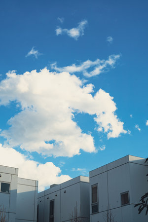 Interesting shaped clouds drifting by.の写真素材
