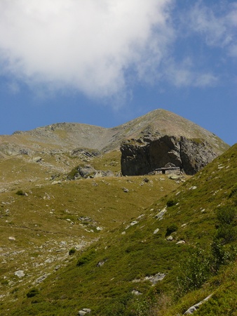 Old cave dweller sheep barn - sheepfold in pre Alps pasture landscape, near refugee Jean Collet, Belledonne, Franceの写真素材